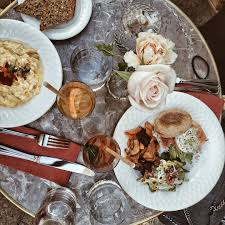 Brunch spot in Cannes with mimosa and breakfast plate as the perfect hangover cure