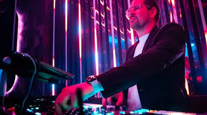 Nightclub in Cannes with top DJ booth and crowd dancing on the French Riviera