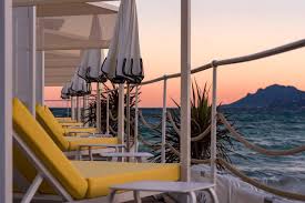 Private beach club in Cannes with sun loungers and cocktails on the French Riviera