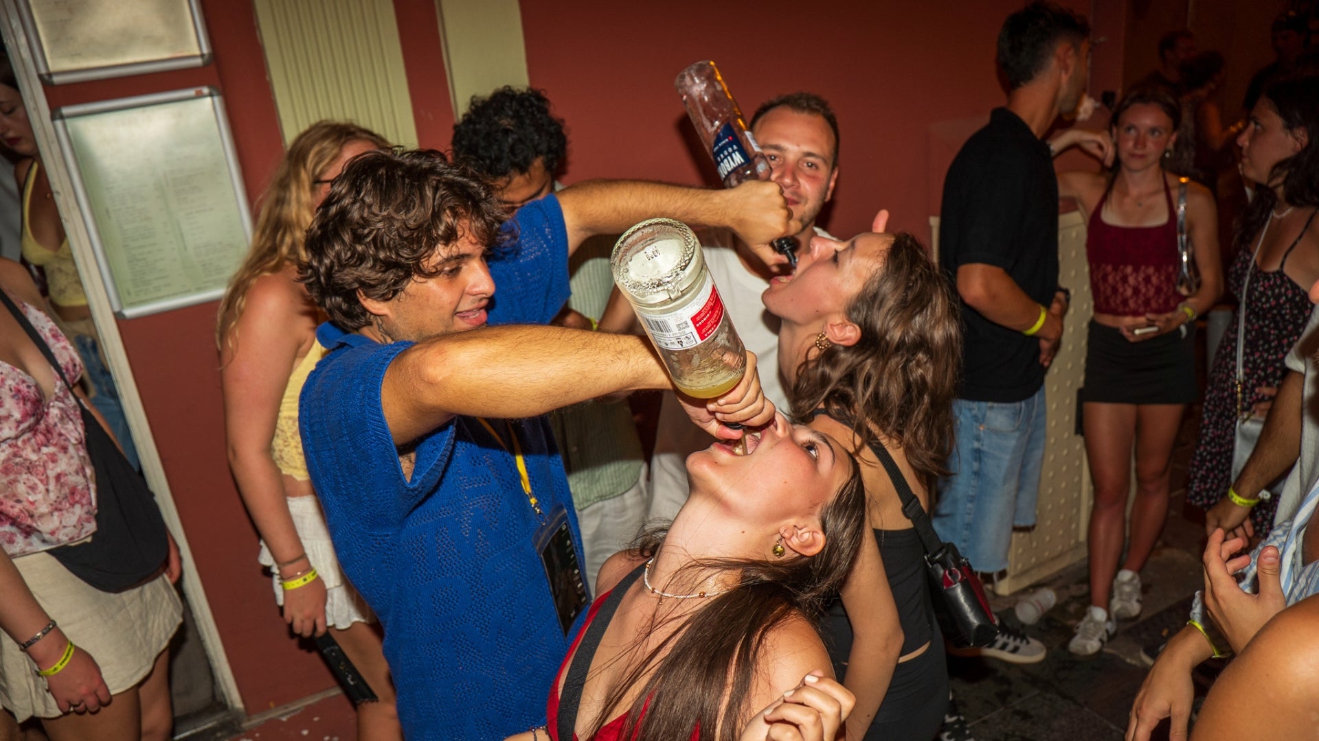 Drinks and shots shared during the Nice Bar Crawl Orange with a fun party crowd in Nice nightlife