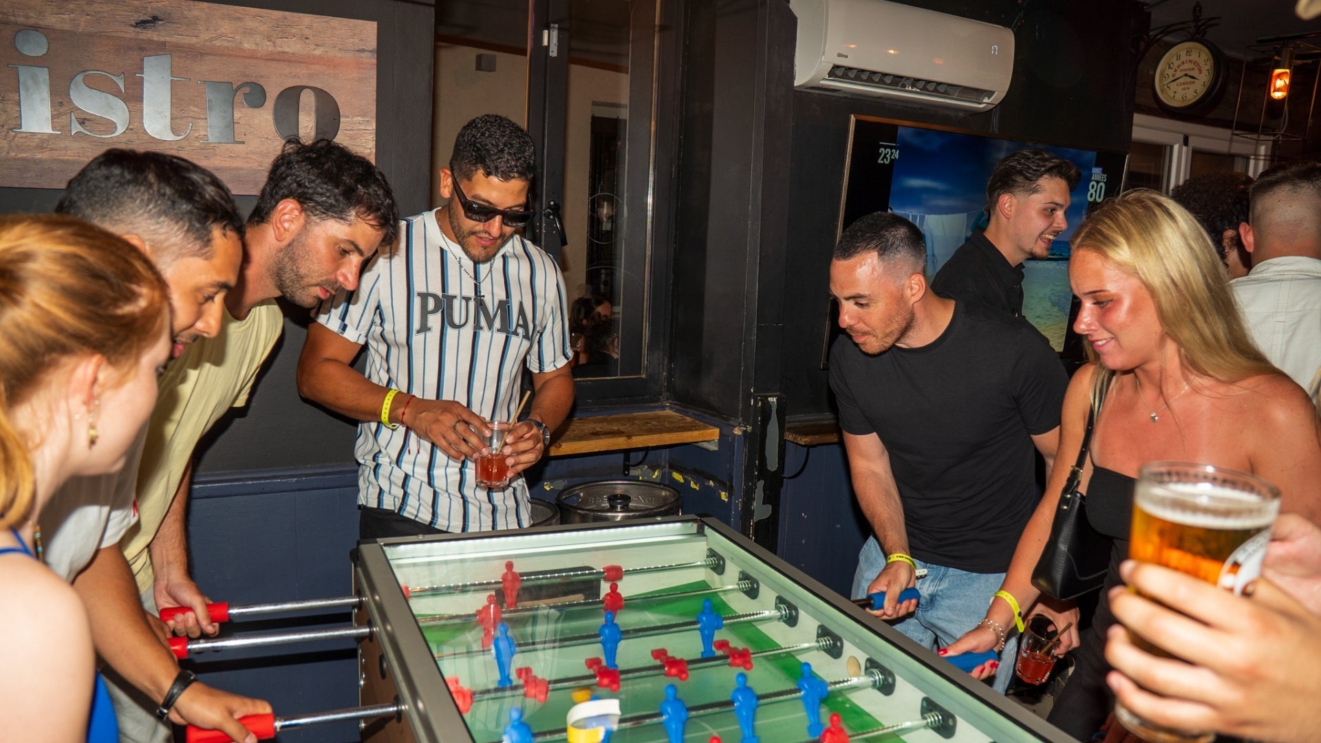 Social nightlife experience during a Nice Pub Crawl with drinks bars and fun group interactions